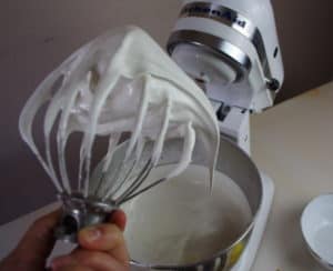 Meringue whipped to stiff peaks on kitchen aid whisk.