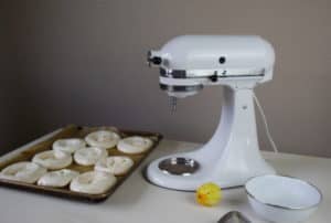 Meringue Shells with Kitchen Aid Mixer and Lemon on Table