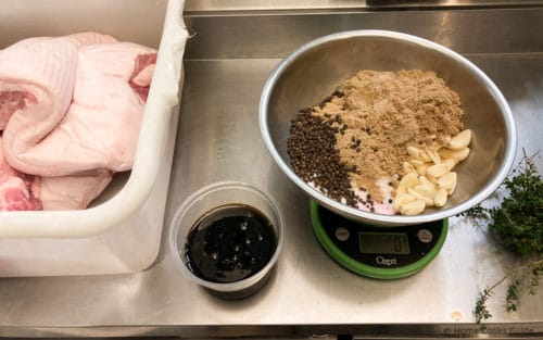 Pork Belly in tub with maple syrup and cure